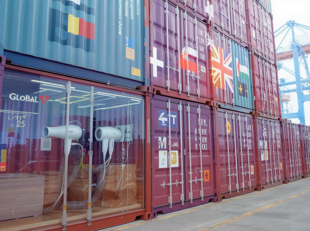 Bulk hair dryer shipping containers at international port facility for wholesale logistics